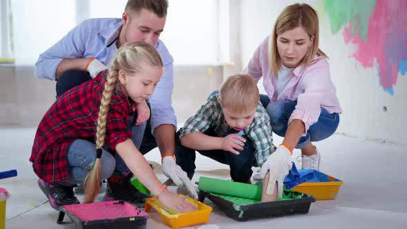 Creative Family Construction Site Girl Boy Down Syndrome Puts Green Yellow Acrylic Paint Hands From