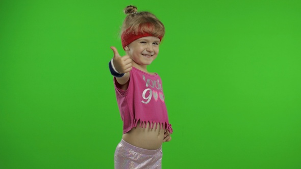 Athletic Girl in Pink Sportswear Is Waving Her Hand Doing Hello Gesture Isolated Over Chroma Key