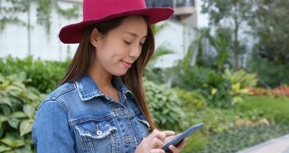 Woman use of mobile phone at outdoor