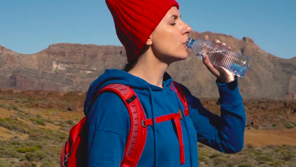 Hiking Woman Drinking Water After Hike on Teide Tenerife