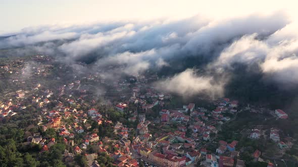 Aerial view above the clouds of Veli Losinj cityscape, Croatia.
