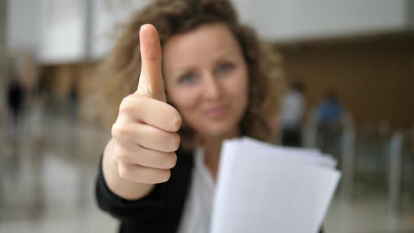 Successful Business Woman Smiling Showing Thumbs Up In Camera