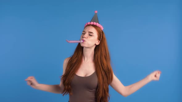 Ginger Woman in Party Hat and Brown Tank Top