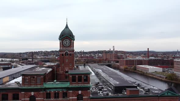 Ayer Mill Clock Tower A Museum Near Merrimack River In Lawrence, Massachusetts, USA. - aerial drone