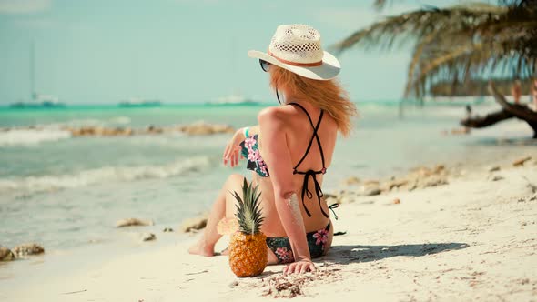 Beautiful Tanned Woman In Swimsuit Healthy Skin Sunbathing Enjoy Vacation.Tanned Girl In Bikini