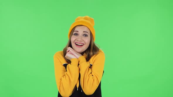 Portrait of Modern Girl in Yellow Hat with Shocked Surprised Wow Face Expression Is Tender Smiling