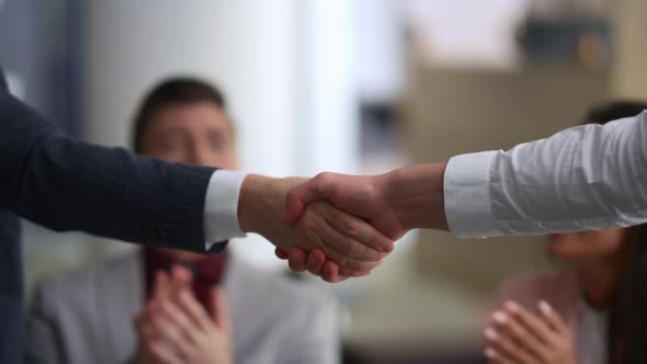 Business People Shaking Hands Making Corporate Deal in Modern Conference Office