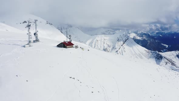 Aerial View of Telecommunication Antennas on the Top of Snowy Mountains