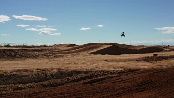 Desert off road vehicle jumps ramp in slow motion