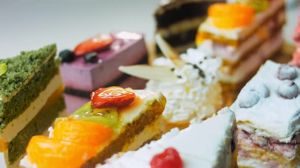 Pieces of Different Cakes on a Retrostyle Baking Tray