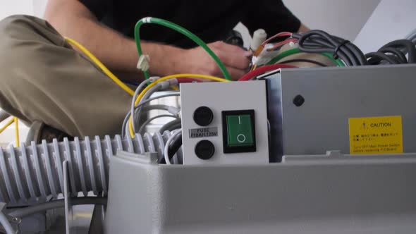 Guy Working on Wiring for Dental Chair