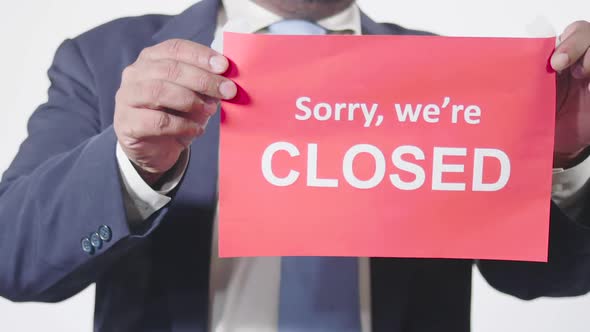 Businessman Posts Sign On Window Sorry Were Closed