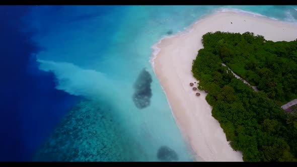Aerial above panorama of exotic tourist beach journey by turquoise water with white sandy background