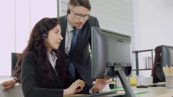 Business People Wearing Headset Working in Office