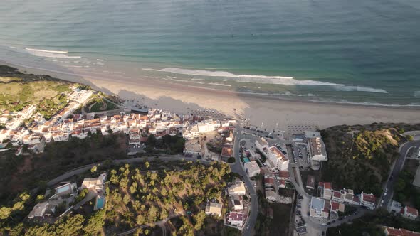 Bird eye view of coastal village Praia da Salema beach in Algarve Portugal.