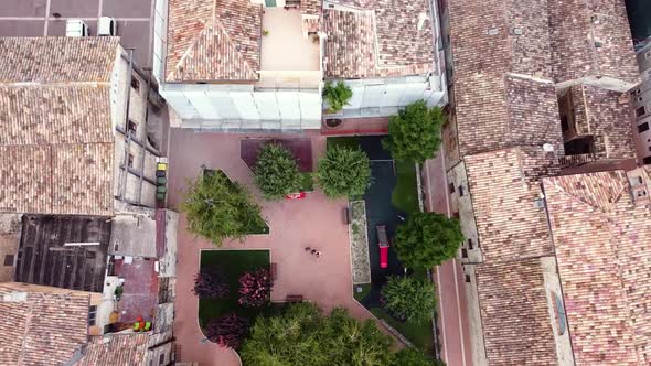 Aerial top down view of a square in a small Italian town