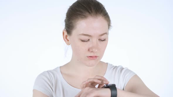 Young Redhead Woman Using Smartwatch, Texting Message