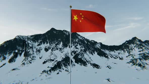 China flag above the snowy mountains. 4K Aerial View