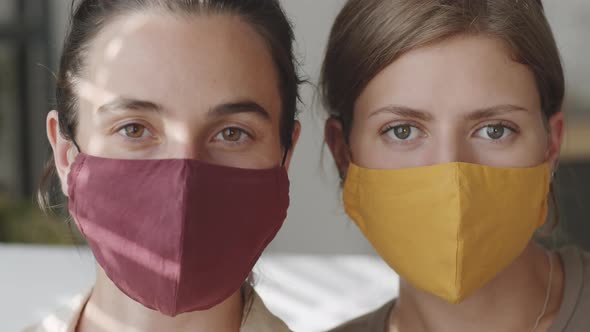 Portrait of Two Women in Protective Masks at Home