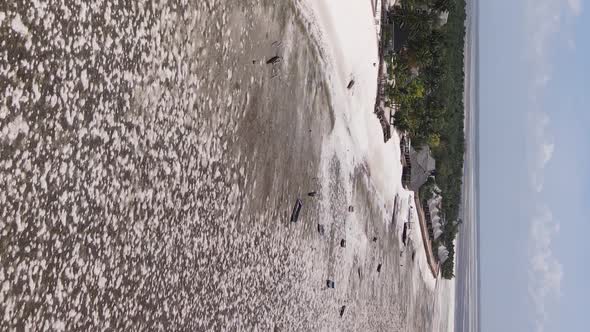 Vertical Video of Low Tide in the Ocean Near the Coast of Zanzibar Tanzania Aerial View