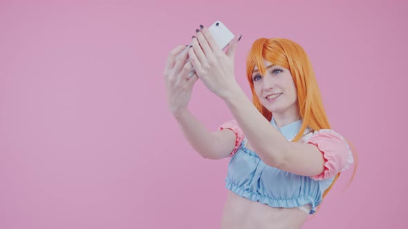 Beginner Caucasian Female Cosplayer Takes Photo Of Herself In A New Ginger Wig Medium Studio Shot