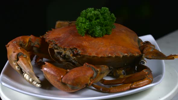 Rotating Boiled Crab on Plate