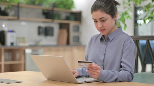 Indian Woman with Unsuccessful Online Shopping On Laptop