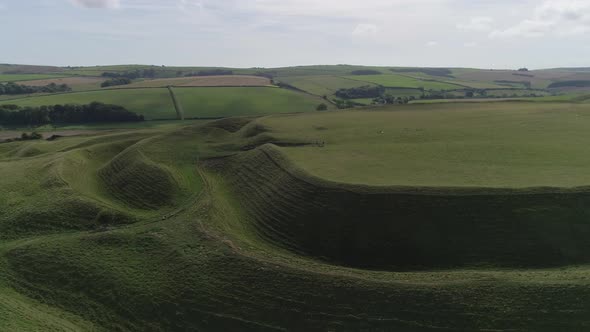 Aerial tracking around the eastern gate of the iron age hill fort, Maiden Castle. The maze-like ramp