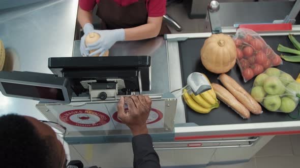 Unrecognizable Customer At Checkout In Hypermarket