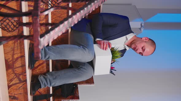 Desperate Businessman Being Fired Sitting on Stairs