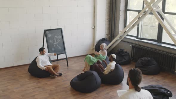 Colleagues Sitting in Coworking