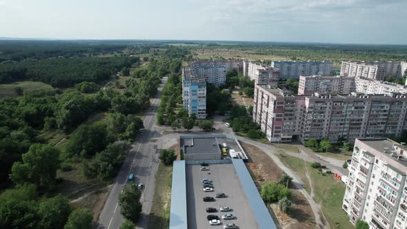 Aerial View MultiStorey Buildings Near Green Forest in Residential Area at City