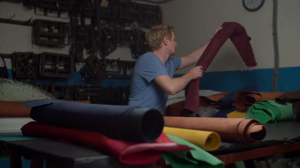 Journeyman Stacking Genuine Leather Rolls to Shelf in Storeroom