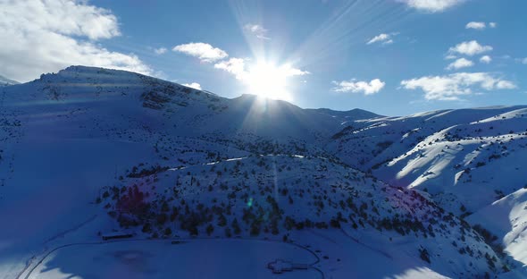 Ski Center Mountains And Sun Aerial View 