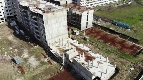 Flying over the unfinished building.