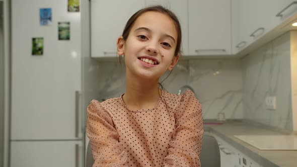 Cheerful Lovely Smiling Girl Expressing Positive Emotions Indoors