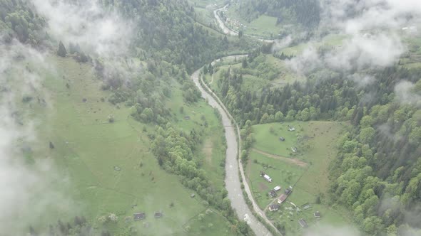 Ukraine, Carpathian Mountains: River in the Mountains. Aerial. Gray, Flat