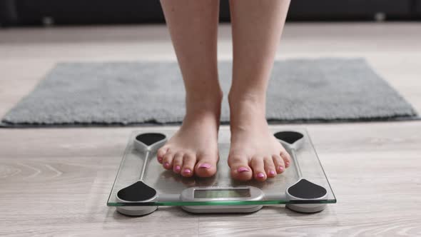 Girl Legs Step On Bathroom Scale On Room