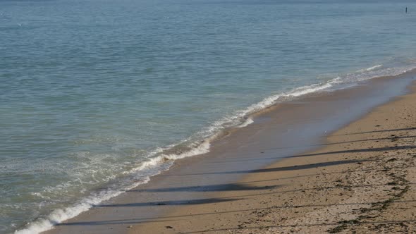 French Normandy landing Sword beach by the day with silouette of flags on sand 4K 2160p UltraHD foot