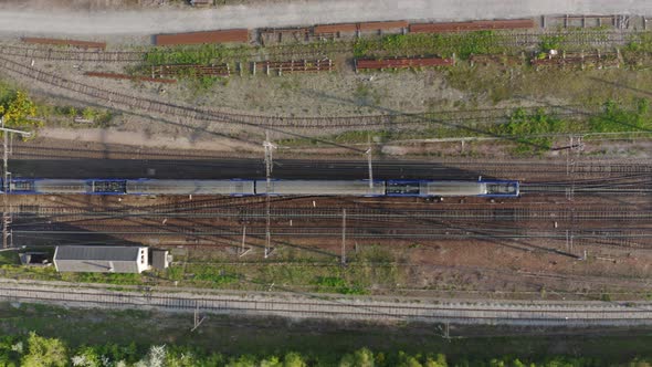 Aerial view. Modern high speed train. Railroad in landscape, aerial view from above. 