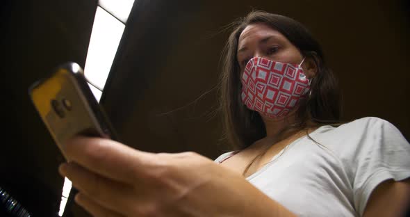 Woman Wearing Mask at Metro Subway with Phone