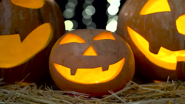 Carved Halloween Pumpkin with Lights on Bokeh Background