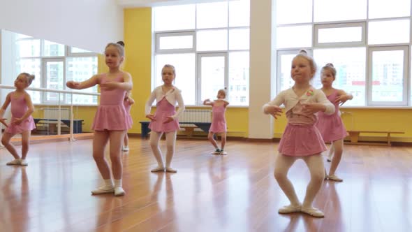 Group of little girls practicing in ballet school