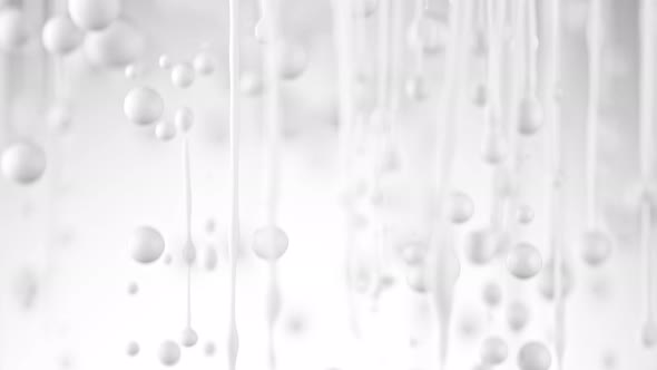 Super Slow Motion Shot of Dripping Milk on White Background at 1000 Fps.