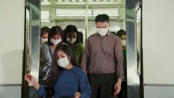 Crowd of People Wearing Face Mask on a Crowded Public Subway Train Travel