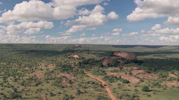 4 wheel drive on safari at Baboon Rock in Laikipia, Kenya. High aerial drone view