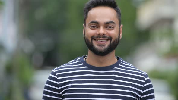 Young Happy Bearded Indian Man Smiling Outdoors