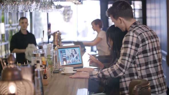 Entrepreneurs Having Video Call at Bar