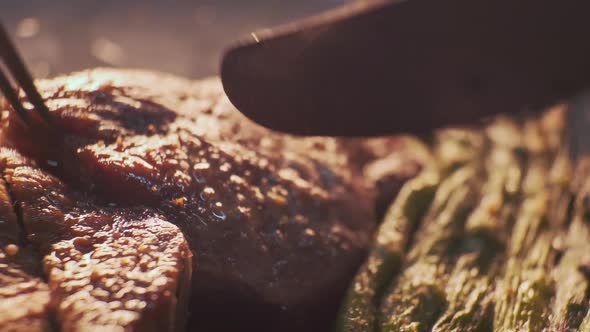 Cutting Steak Using a Fork and Knife Closeup