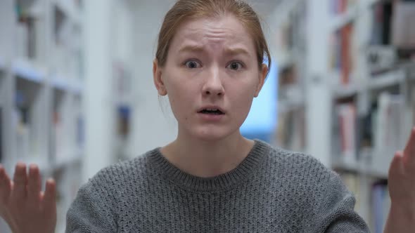 Portrait of Young Woman in Anger Yelling in Cafe